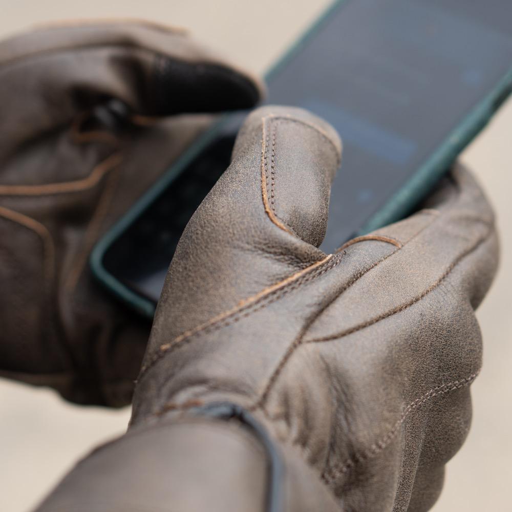 The Original gloves typing on a touch screen phone